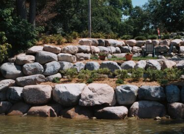 Boulder retaining wall shoreline restoration 