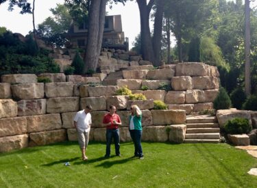 Boulder retaining wall with staircase