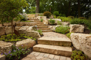 Boulder lined walkway with stone steps