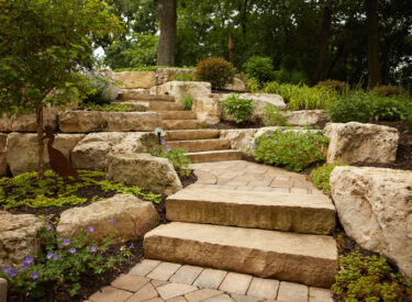 Boulder lined walkway with stone steps