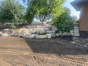 The back yard boulder retaining wall prescott wisconsin